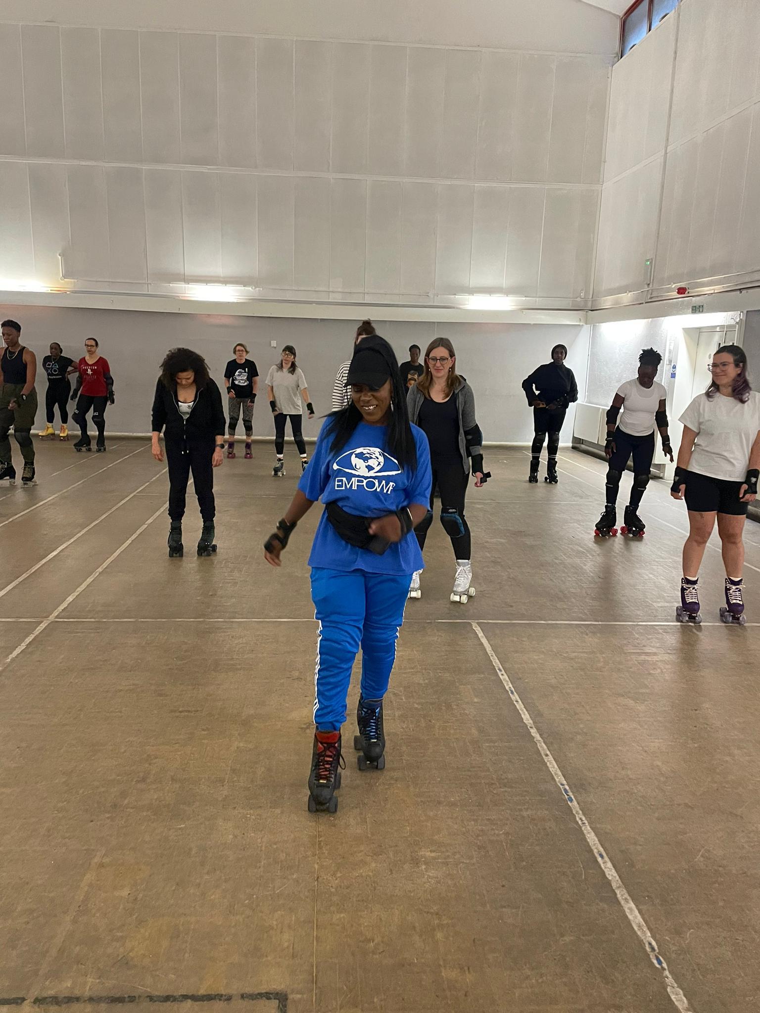 Adults roller skating at Empowr CIC