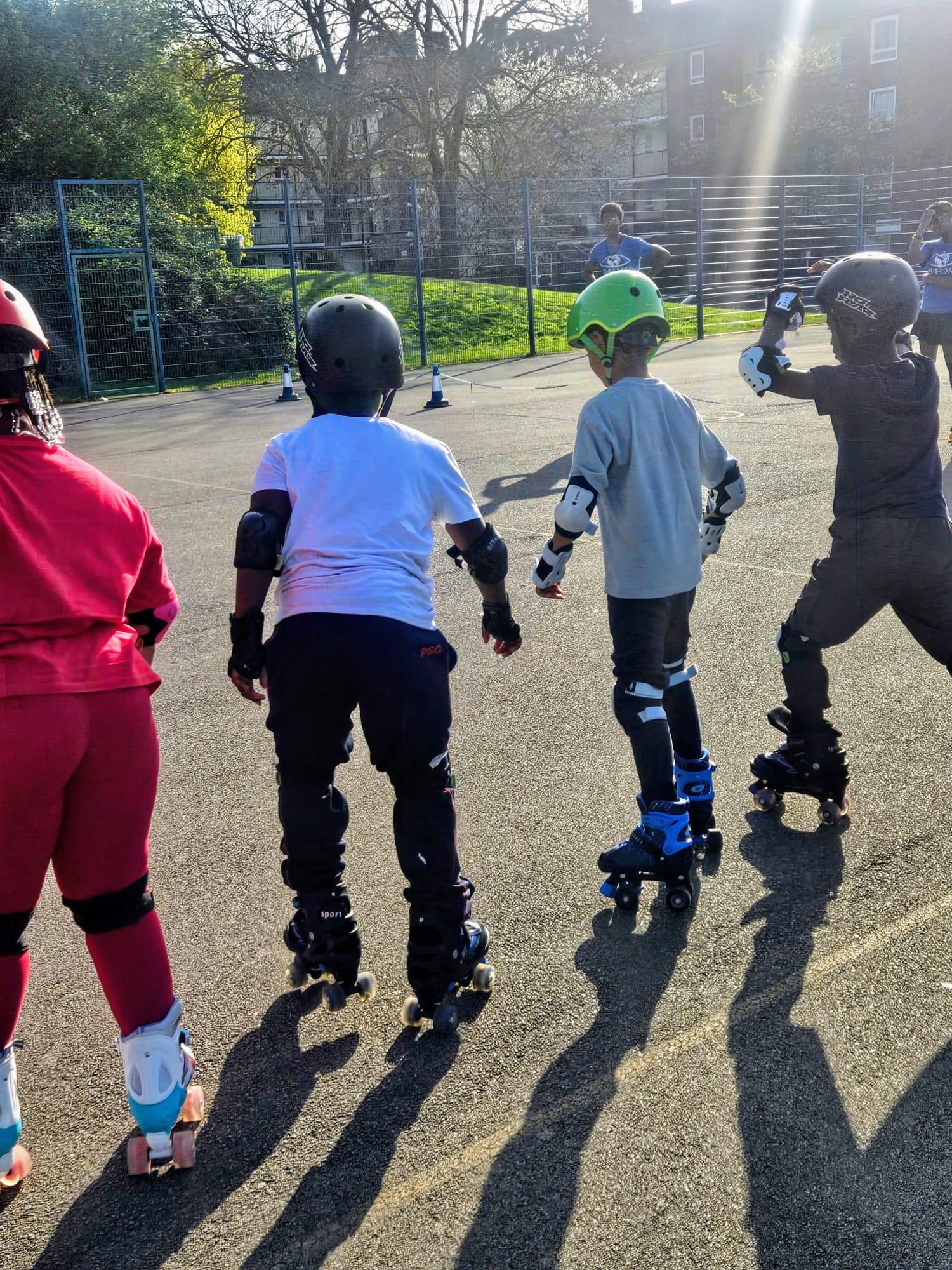 Children roller skating at Empowr CIC
