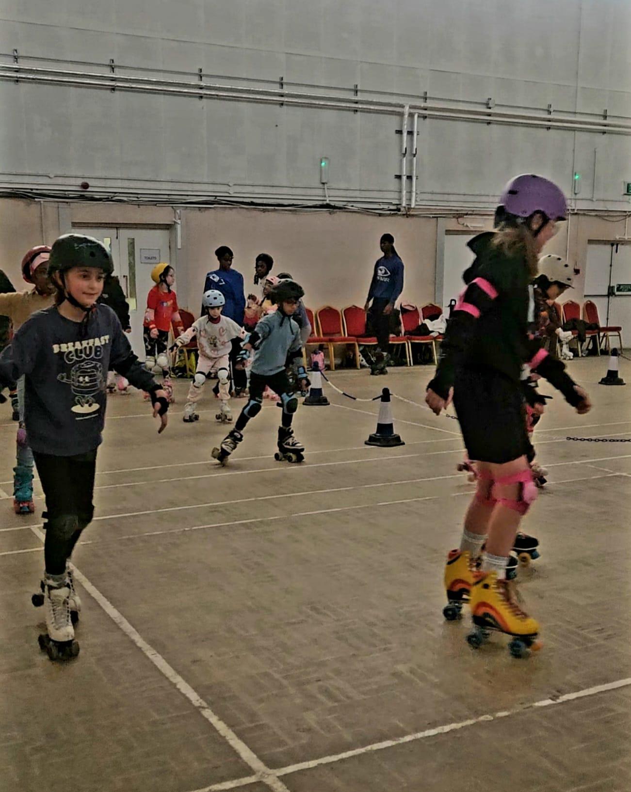 Children at Empowr Camps roller skating session